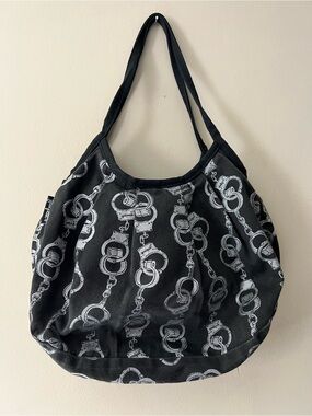 Vintage Yak-Pak shoulder bag in black denim with all over silver handcuff print.